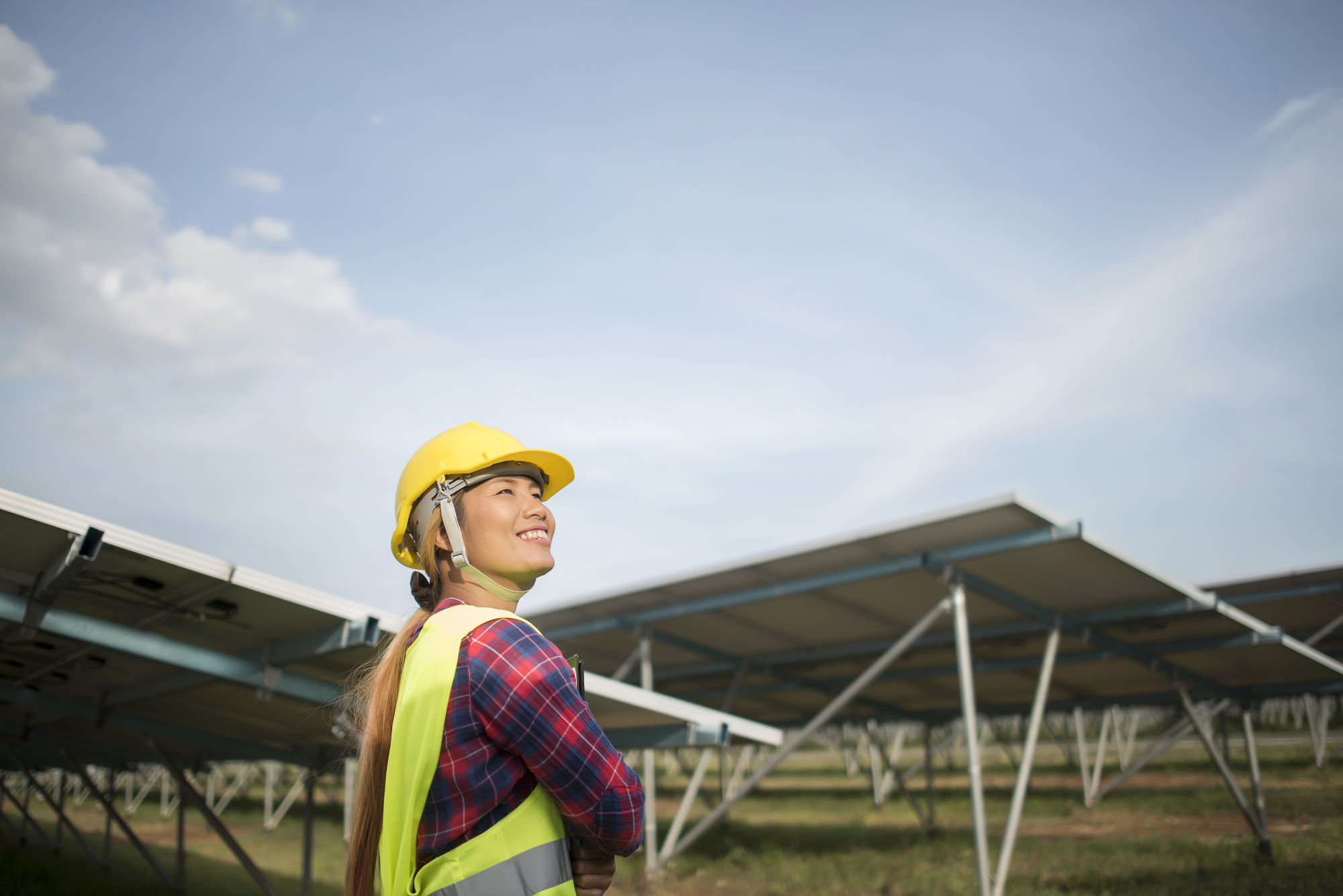 Engineer electric woman checking and maintenance of solar cells.